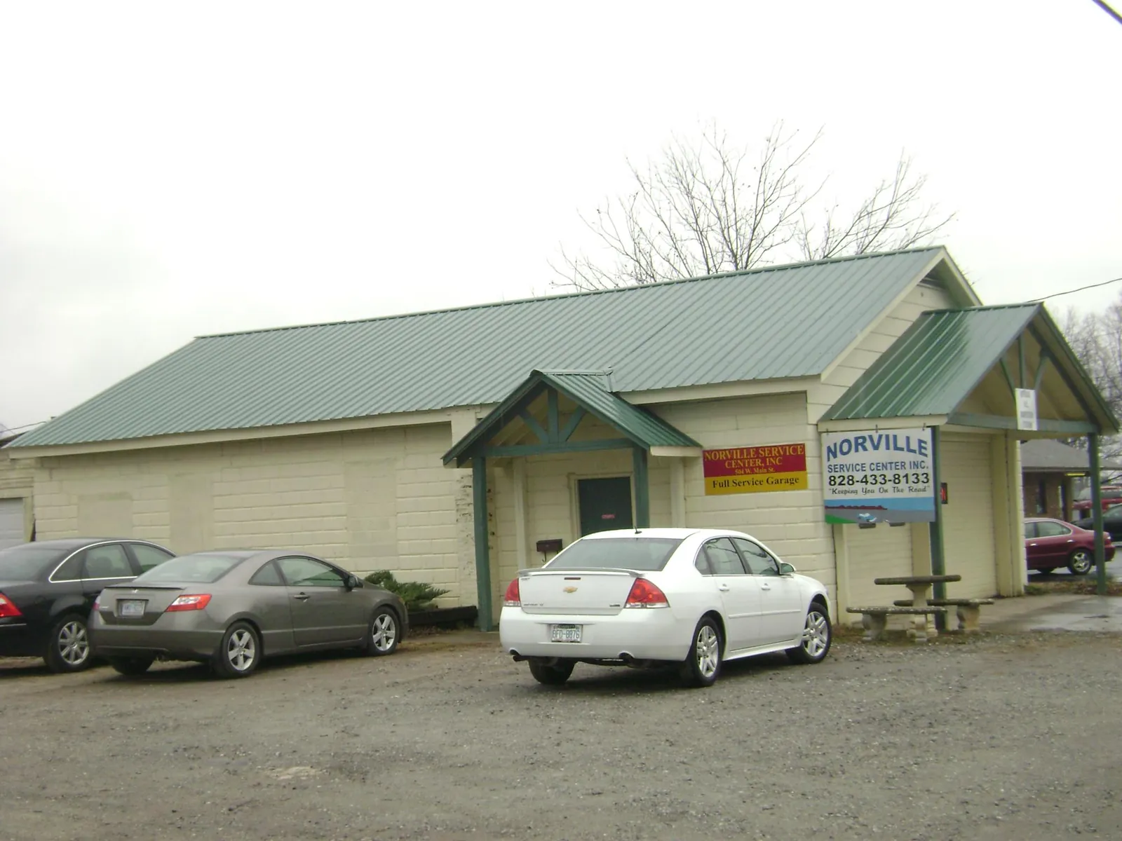 Green metal roof on a service garage with a covered entry in Hayward